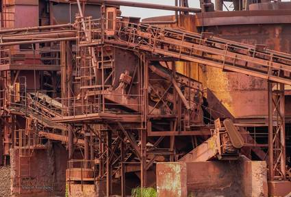rust coated beams blocks and conveyors at a steel mill