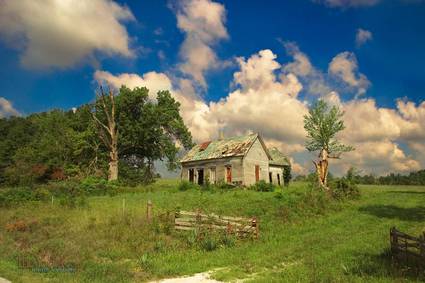 A picture of an Iowan cabin under a big sky