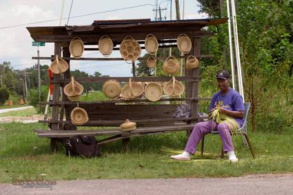 a basket weaver and her inventory outside of Charleston, SC