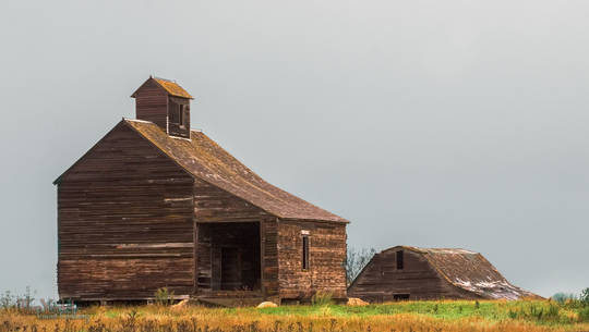 An outbuilding on a hill on a  South Dakota farm