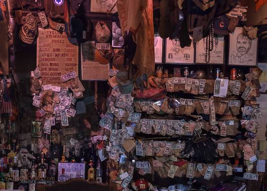 Stuff on the wall behind the bar at Evelyns Place