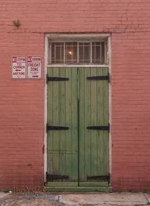 Green Door in a Pink Wall