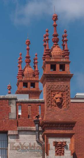 a close up of one of the terra cotta crowns on Flaglers Alcazar