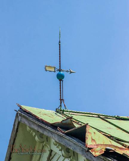 On top of this old tin roof there is a lightening rod