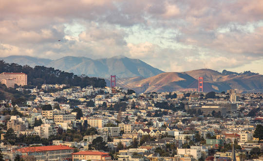 Golden Gate Bridge with puffy clouds