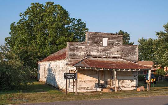 tiny old store with sign