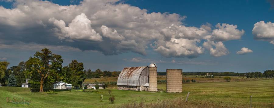 a nice barn made with round stones and in interesting silo