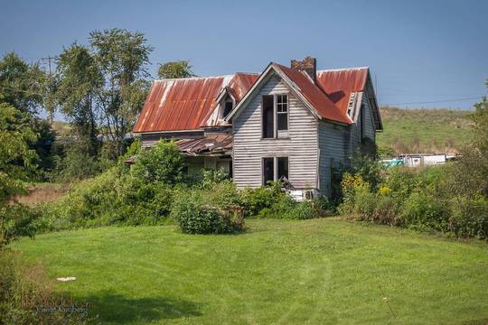 old house with a cool rusty roof