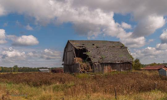 There is a huge hole in the side of this barn