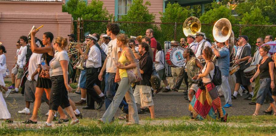 the second line parades down the street